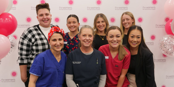 Winners of the 2024 Nursing and Midwifery Awards smile at the camera, surrounded by balloons.